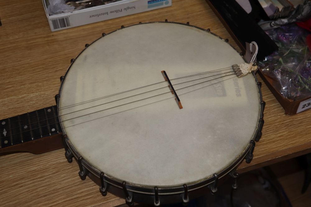 A six string banjo, length 94cm